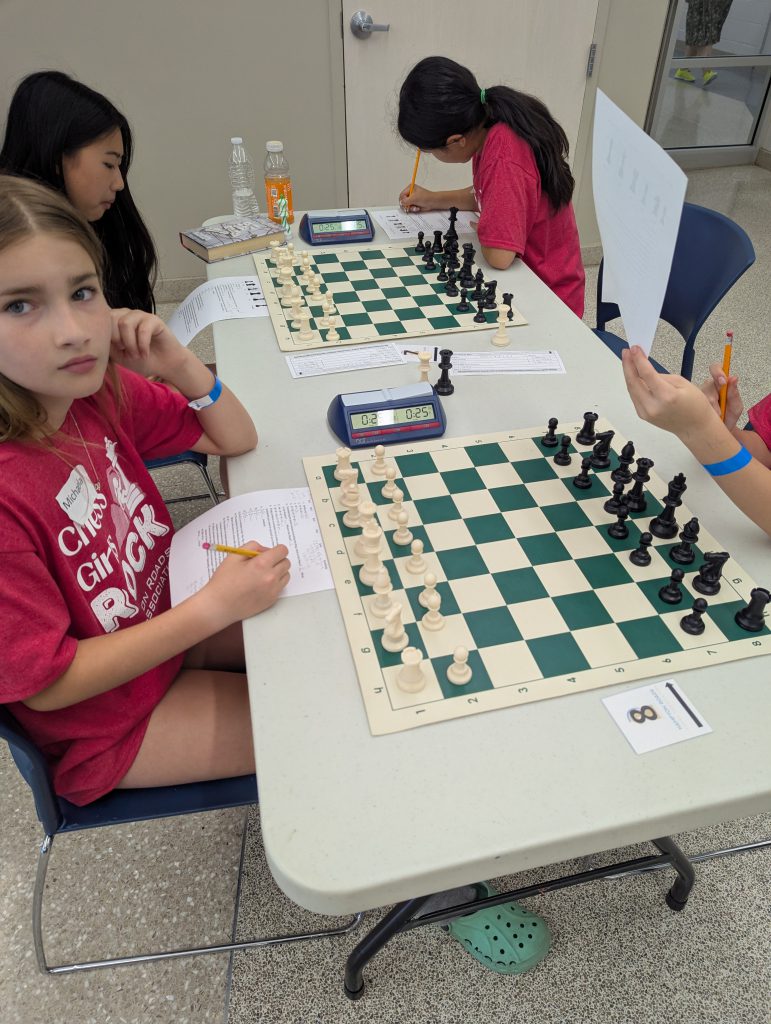 Girls playing chess at annual Chess Girls Rock event
